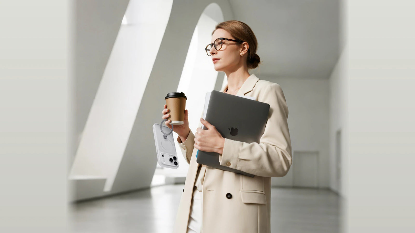 Professional woman carrying a CASEKOO Frost case securely by its ring stand