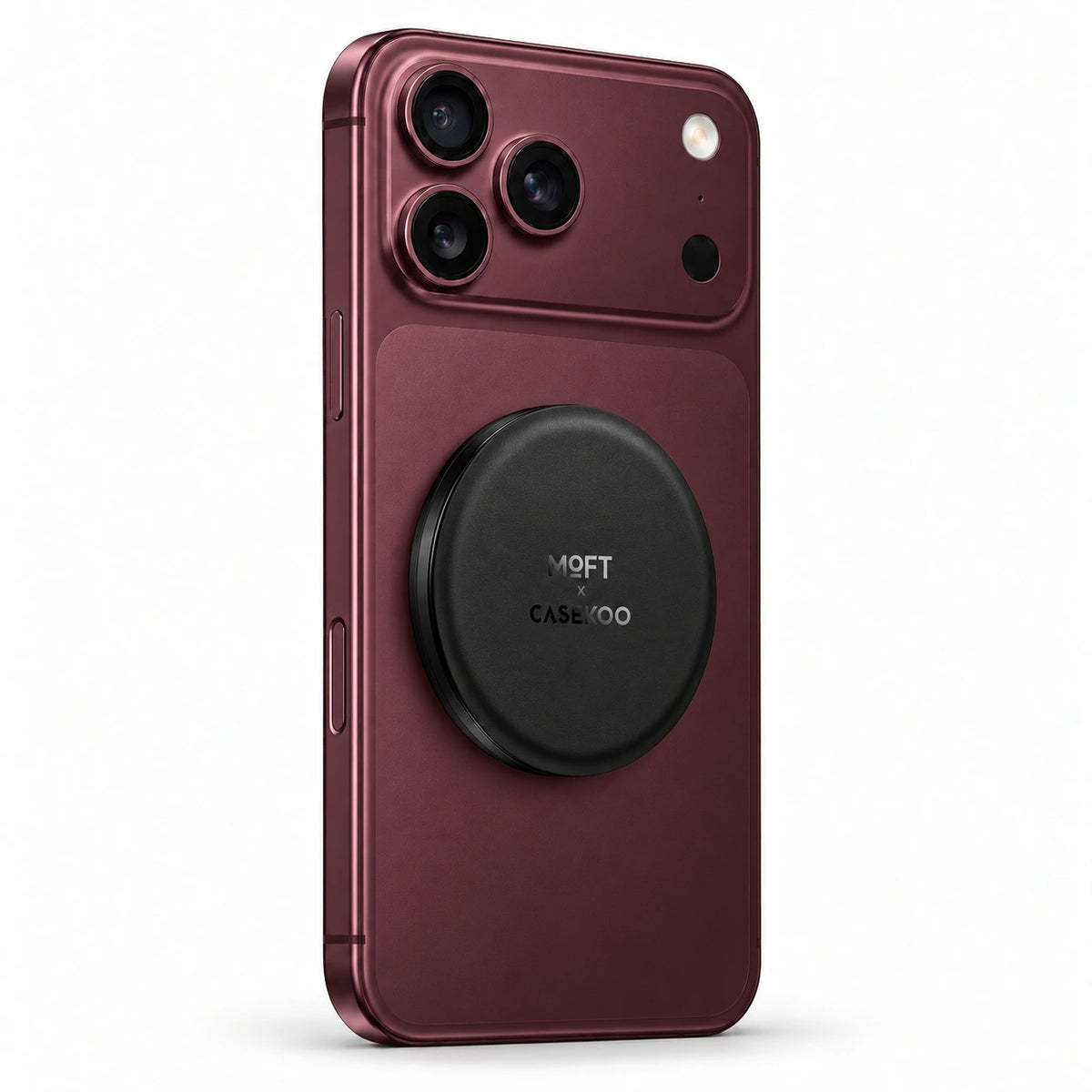 Black MOFT × CASEKOO stand on a Burgundy iPhone