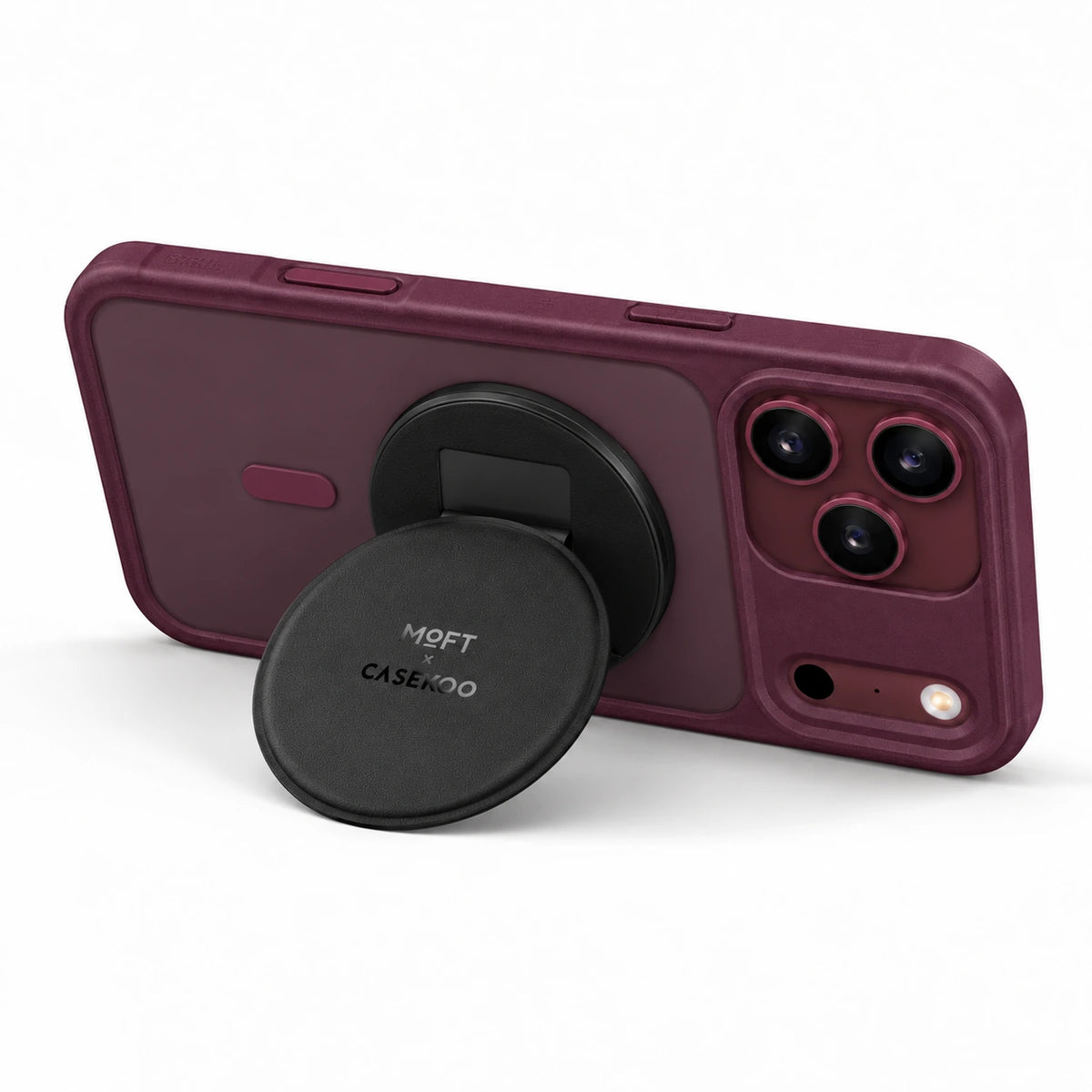 MOFT × CASEKOO stand supporting a Burgundy PureKOO case in landscape