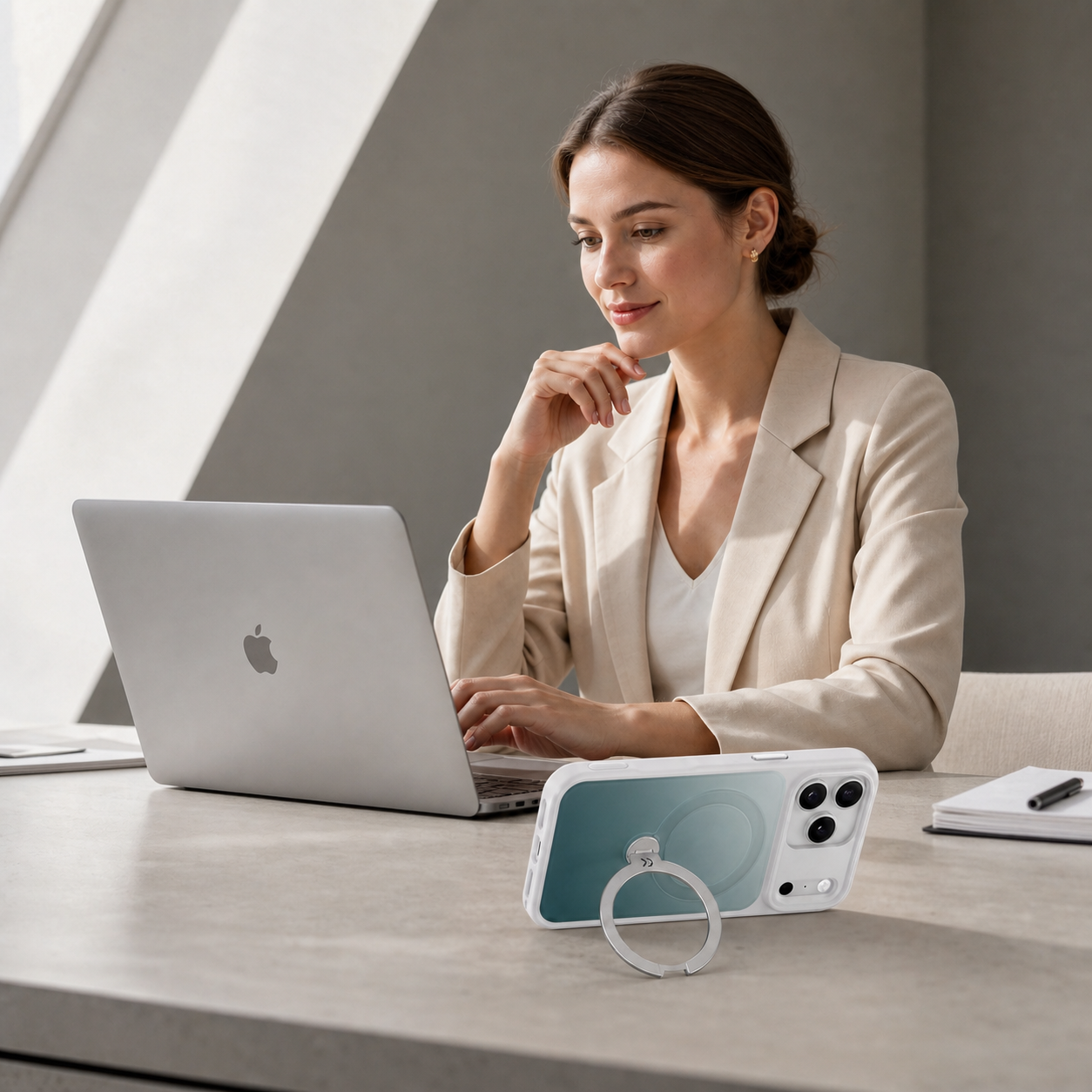 Professional woman working beside a StandKOO Frost Gradient Green case in landscape stand mode