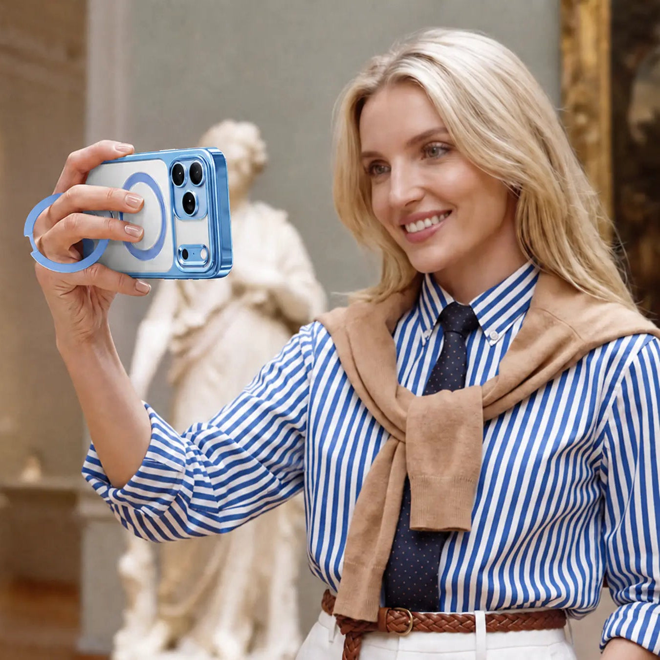 Woman using the StandKOO Halo Gentle Blue ring grip in a business setting