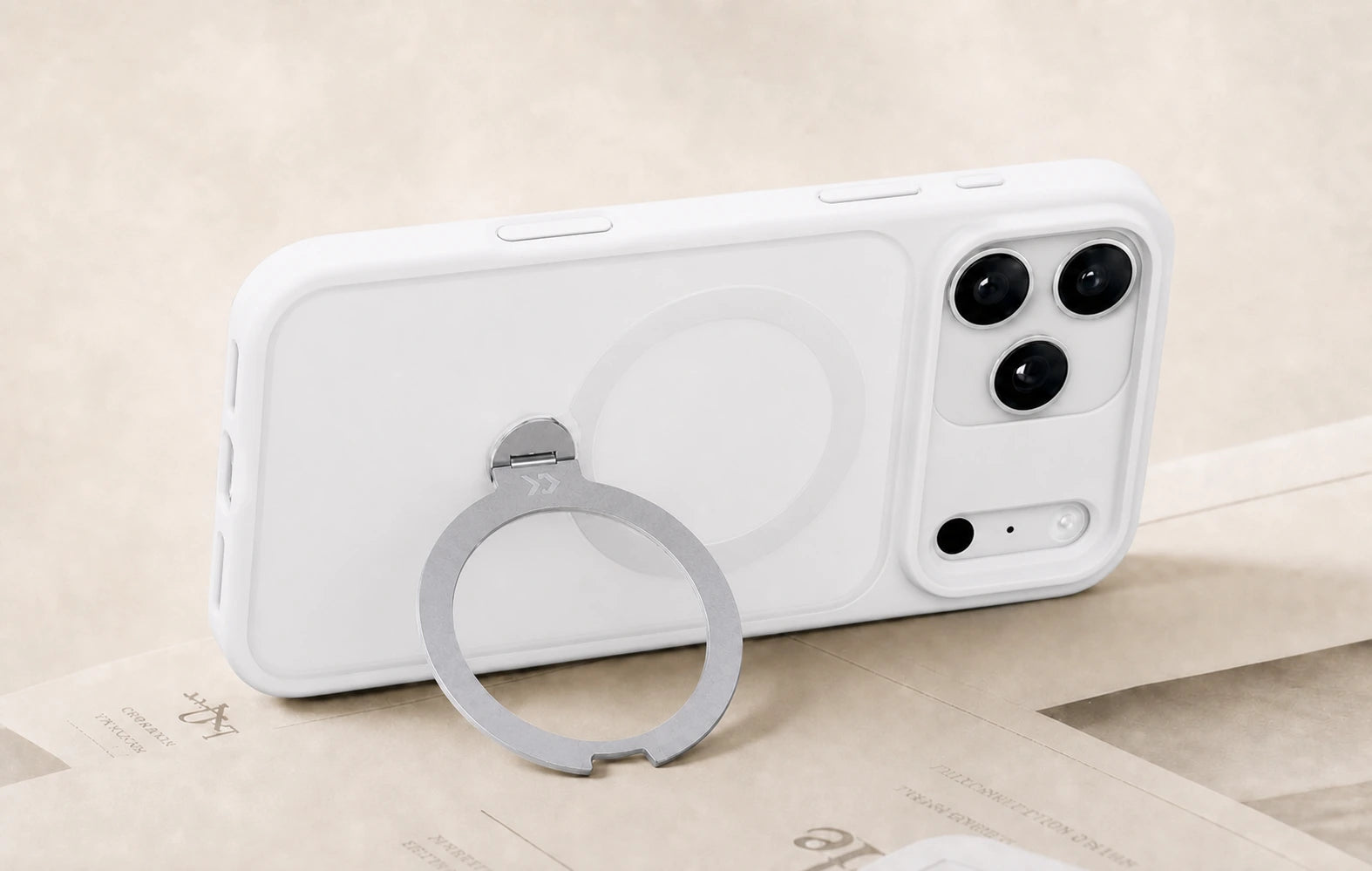 Cozy White StandKOO Frost case with its 360° ring open and supporting the phone on a desk
